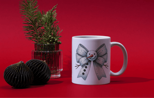 Ink and Charms Designs Mugs Snowman's bow Mug